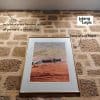 Framed desert artwork on sandstone wall hung from hidden ArtiTeq Shadowline Masonry picture rail; only a slim shadow line shows