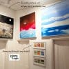 Multiple canvases hung at different heights from hidden ArtiTeq Shadowline Masonry picture rail; only slim shadow line visible