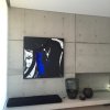 Abstract artwork on off‑form concrete wall hung from hidden ArtiTeq Shadowline Masonry picture rail, fine shadow line
