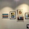 Framed artworks displayed using Artiteq Perlon & Loop system on a Victorian-style timber picture rail at Hang Logic.