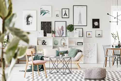 Themed wall with various framed artworks and decorations, creating a cohesive and stylish display.