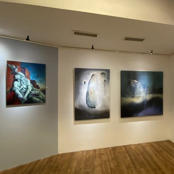 Corner gallery wall showing large oils lit by Combi Rail PRO Light track
