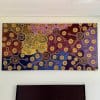 Colourful dot canvas above bed hung on wires from hidden ArtiTeq Shadowline Drywall picture rail