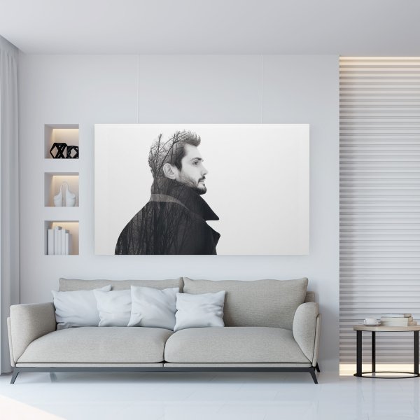 Large black and white portrait canvas above sofa hung on clear wires from hidden ArtiTeq Shadowline Masonry picture rail