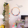 Up Rail - wall-friendly ceiling picture rail Up Rail ceiling-fixed picture rail in a home office, keeping walls pristine while allowing easy, flexible hanging.