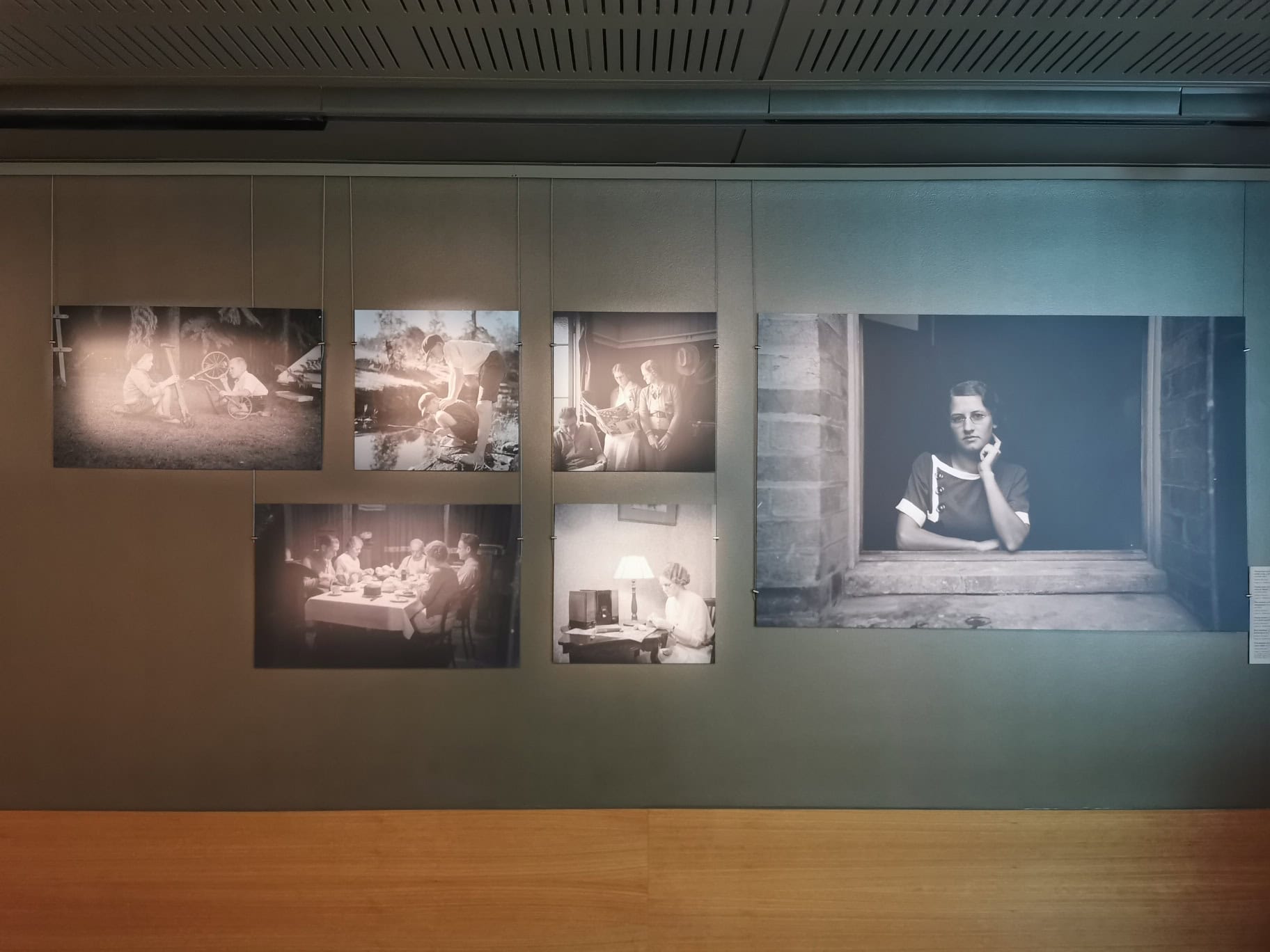 Gallery wall display hanging from Click Rail Pro picture rails with clamps on cables | Hang Logic