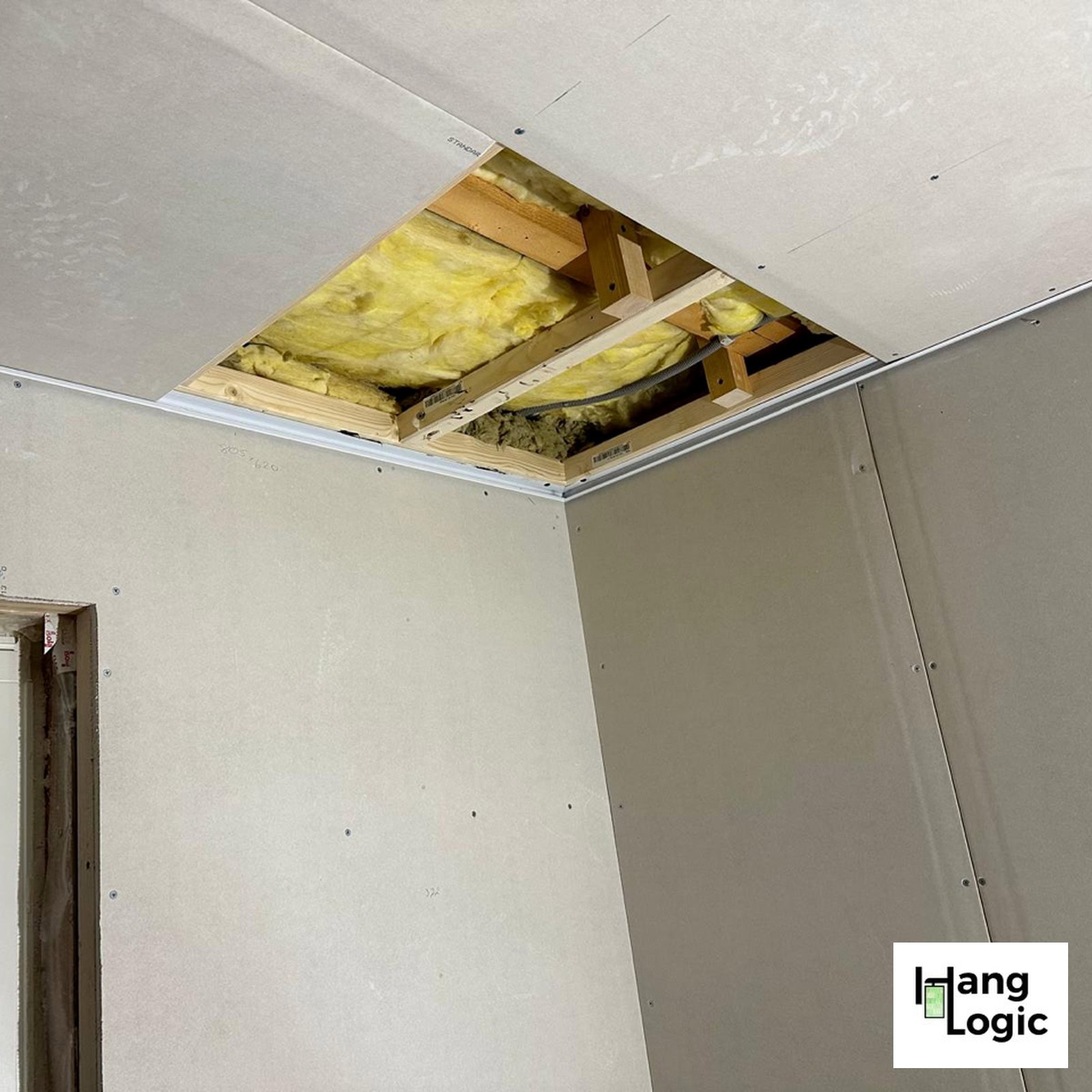 Shadowline Drywall installed around a timber-framed room before the ceiling plasterboard is completed.